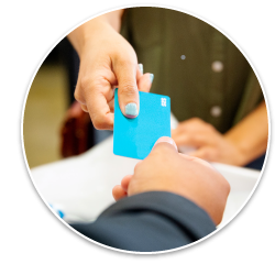 One person handing a card to another.