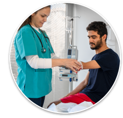 A nurse applying a bandage to a man's arm with a limb difference, appearing to be in his late 20's/early 30's.
